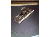 Metal dog figure on a marble base