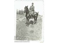 Small old photo of a military cavalryman on a horse E642