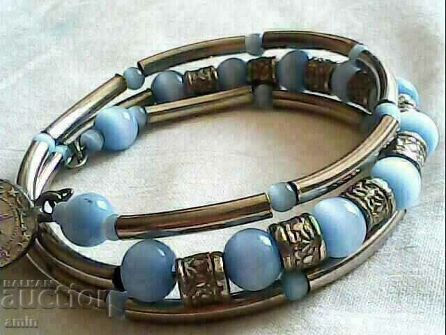 Auction  Old bracelet made of natural stone with a coin