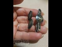 Silver cufflinks and Siam needle