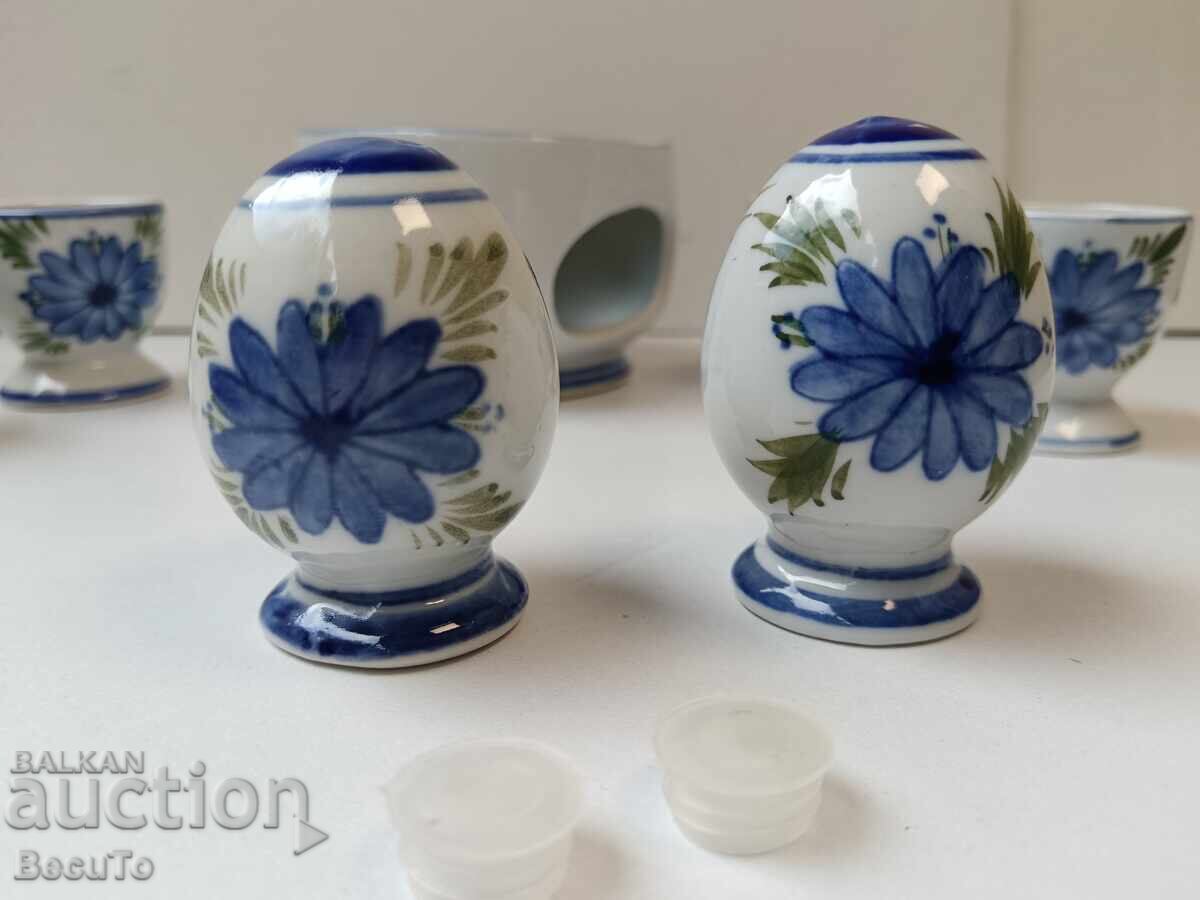Auction Porcelain breakfast set with egg cups, salt shakers, and a container for Auction Porcelain breakfast set with egg cups, salt shakers, and a container for