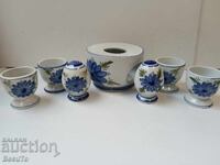 Porcelain breakfast set with egg cups, salt shakers, and a container for