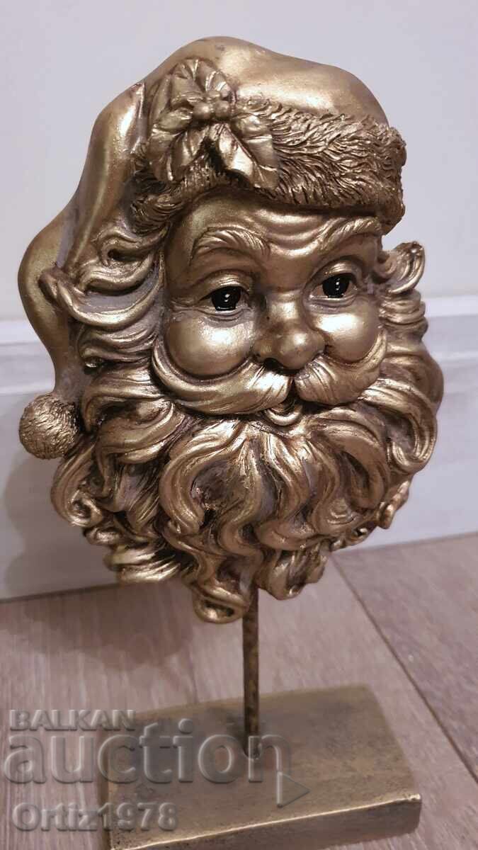 Златен Дядо Коледа на стойка– 26см с цена 37.00 лв. | € 18.92 Златен Дядо Коледа на стойка– 26см с цена 37.00 лв. | € 18.92