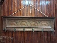 Wooden wall hanger with carving and bronze hooks
