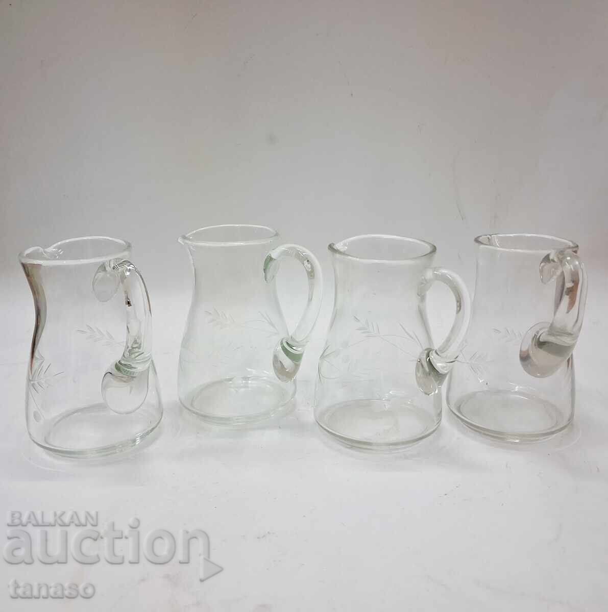 4 glass pitchers with engraved floral motifs with price € 24.00 | 46.94 BGN