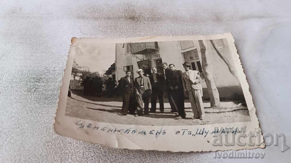 Photo of Men in front of the Shumata