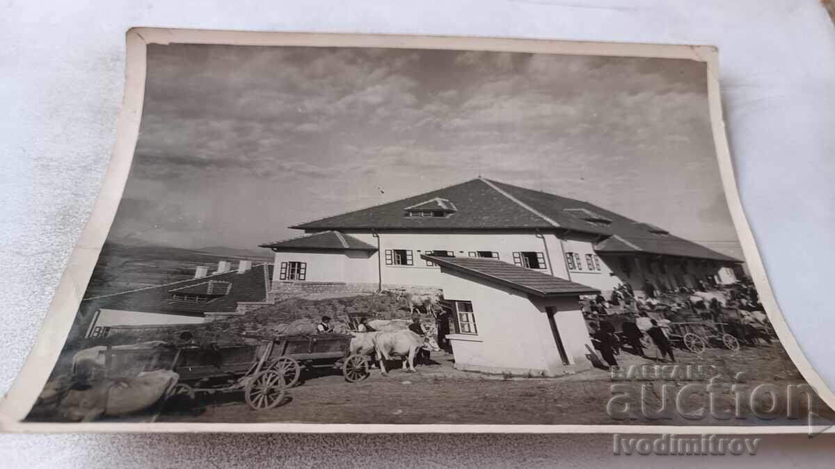 Photograph Men with carts in front of a winery Photograph Men with carts in front of a winery