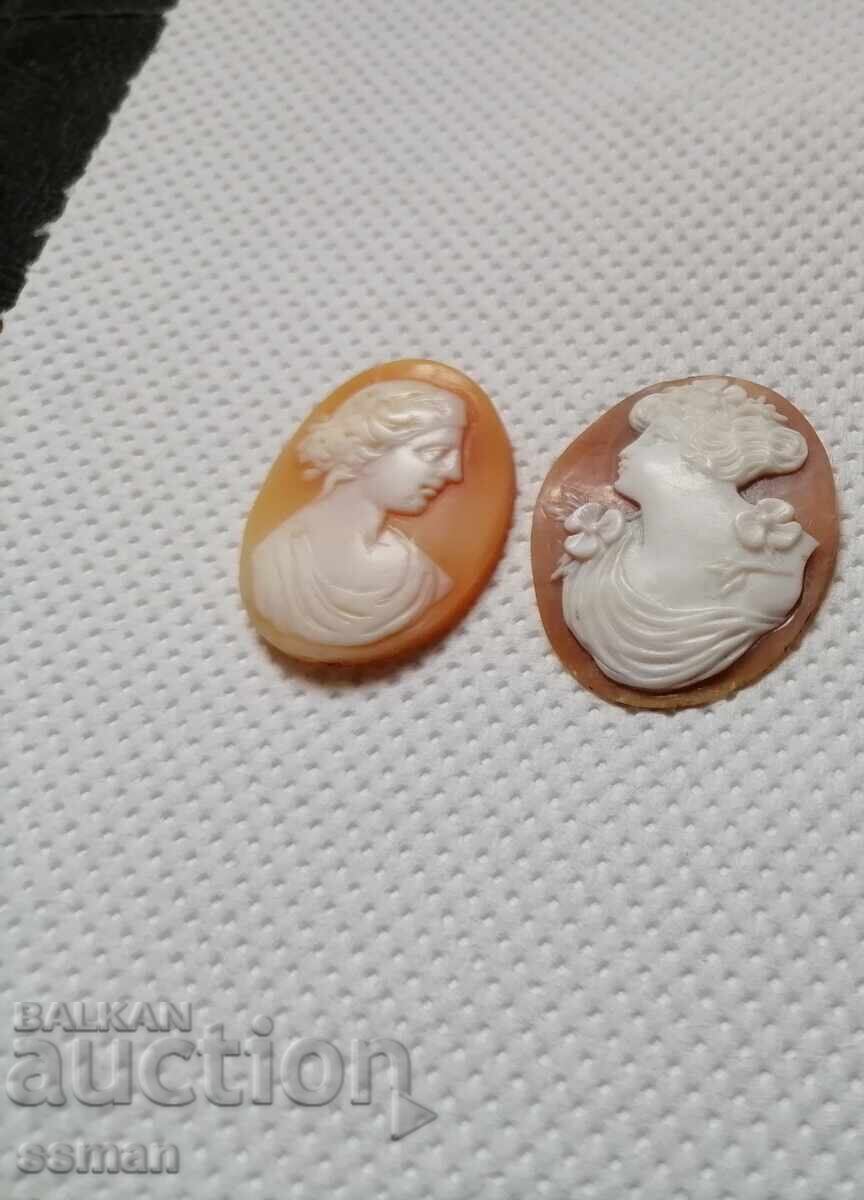 Old cameo cameos from a conch shell, one is on a silver carrier