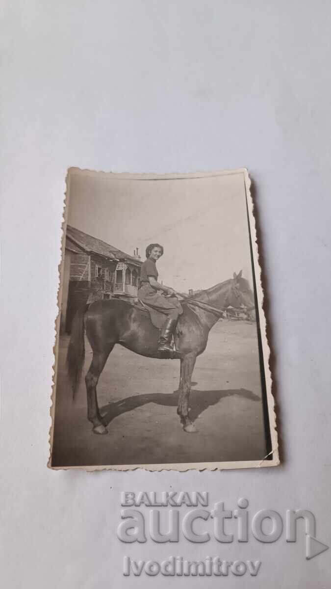 Photo of a Young Girl on a Black Horse Photo of a Young Girl on a Black Horse