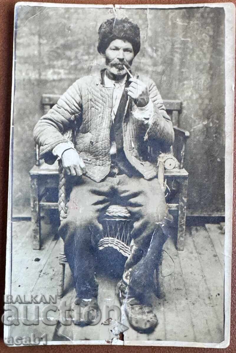 Grandfather with a pipe Studio photography