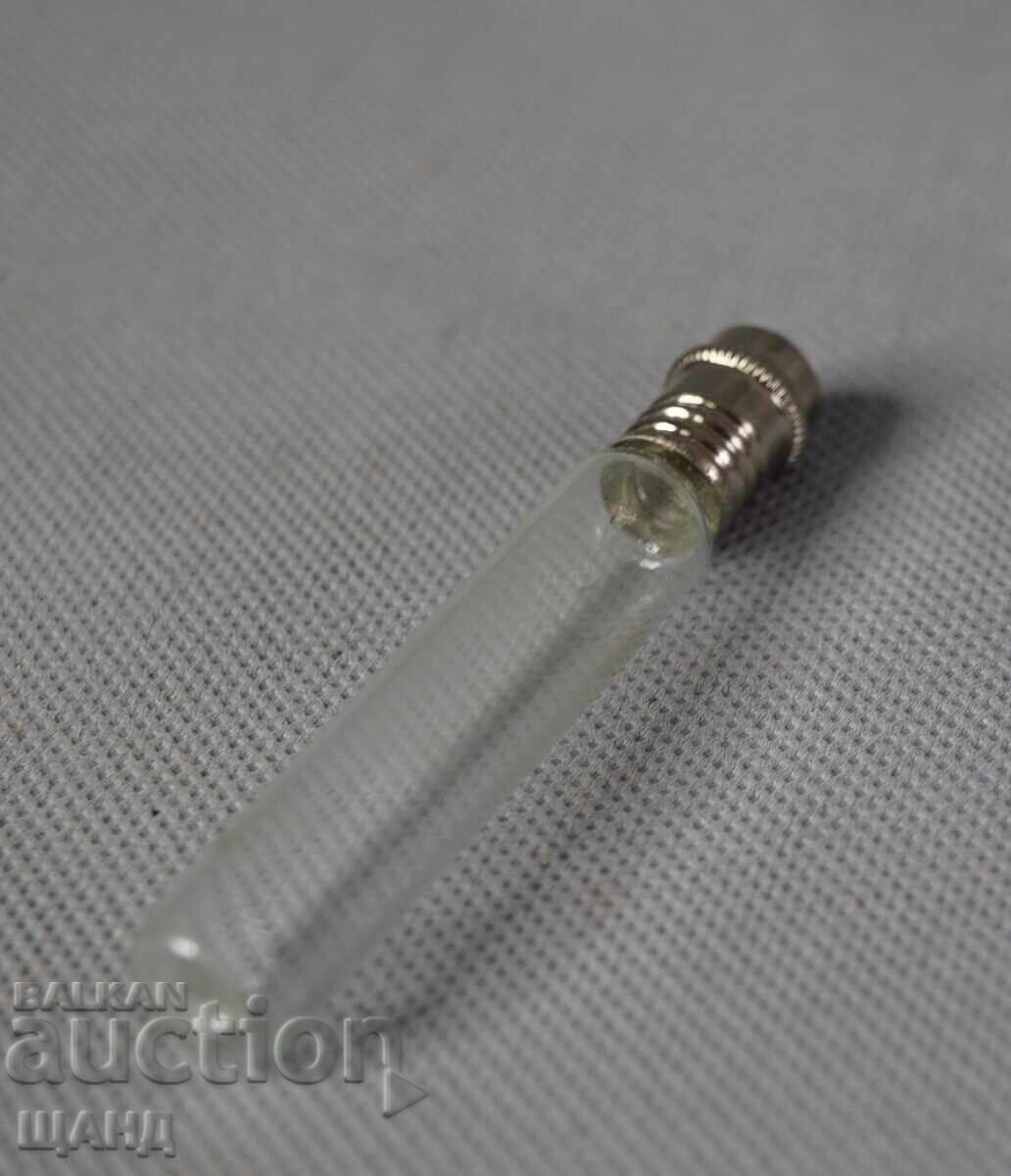 Auction Old glass perfume bottle with a metal container Auction Old glass perfume bottle with a metal container