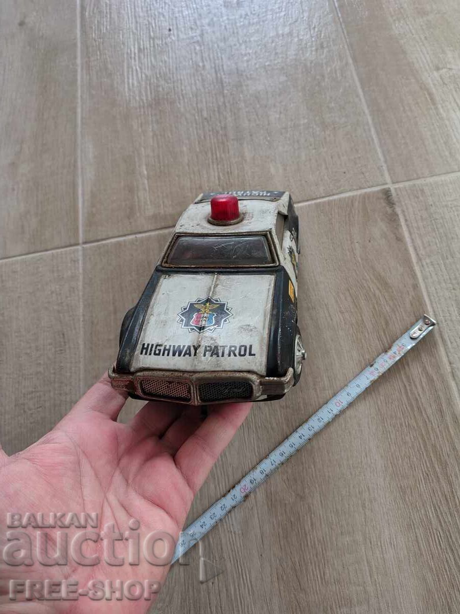 Licitație O jucărie veche de tablă