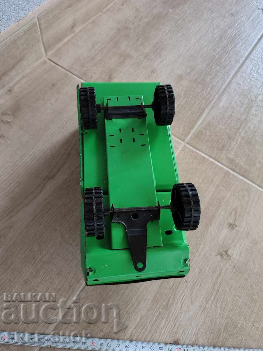 An old tin toy with price € 20.00 | 39.12 BGN An old tin toy with price € 20.00 | 39.12 BGN