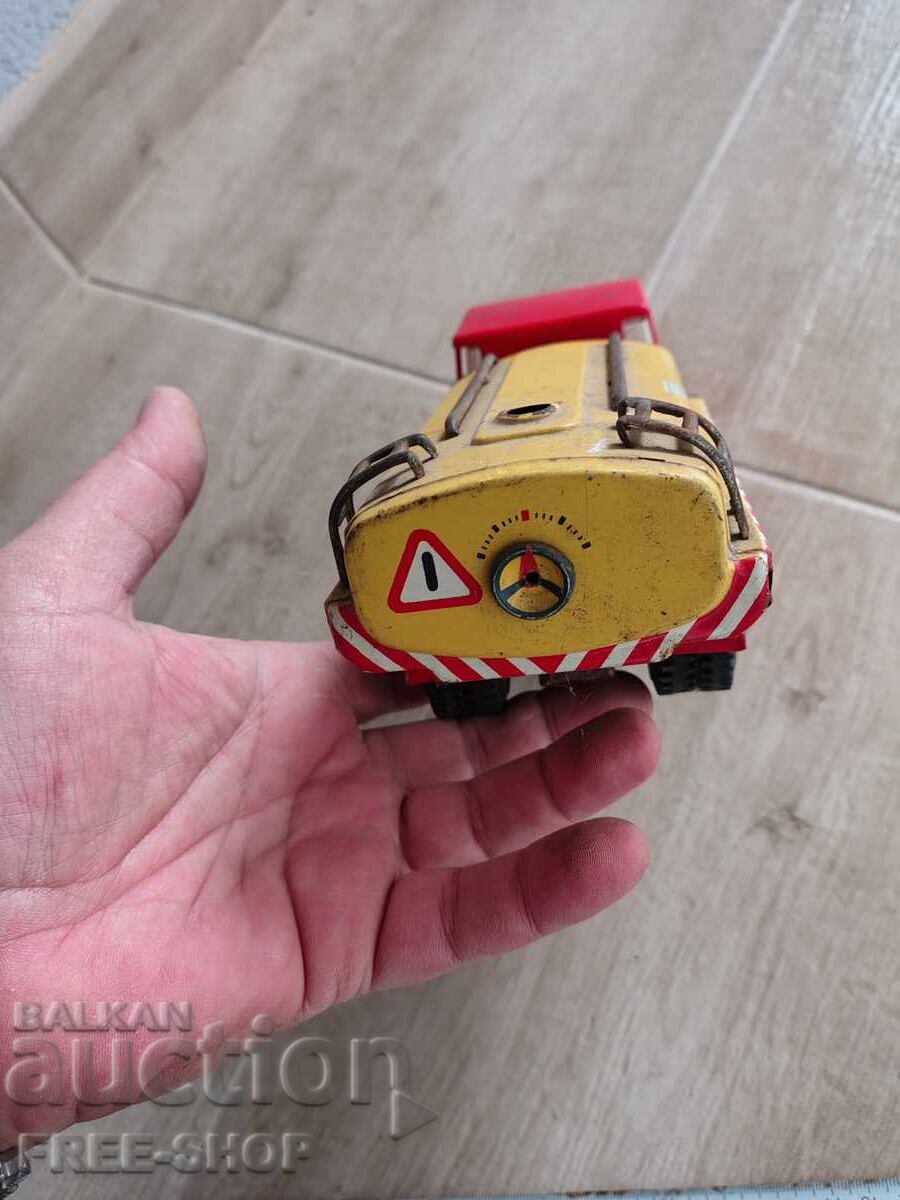 Auction An old tin toy Auction An old tin toy