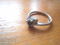 Old metal women's ring with a stone