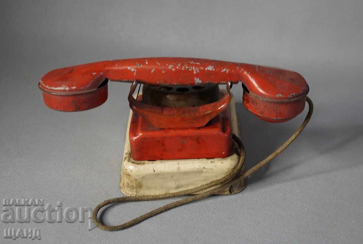 Delivery of Old Metal Sheet Toy Model Phone
