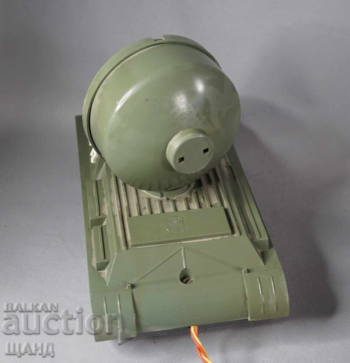 Delivery of Old Russian plastic toy model tank with a spotlight
