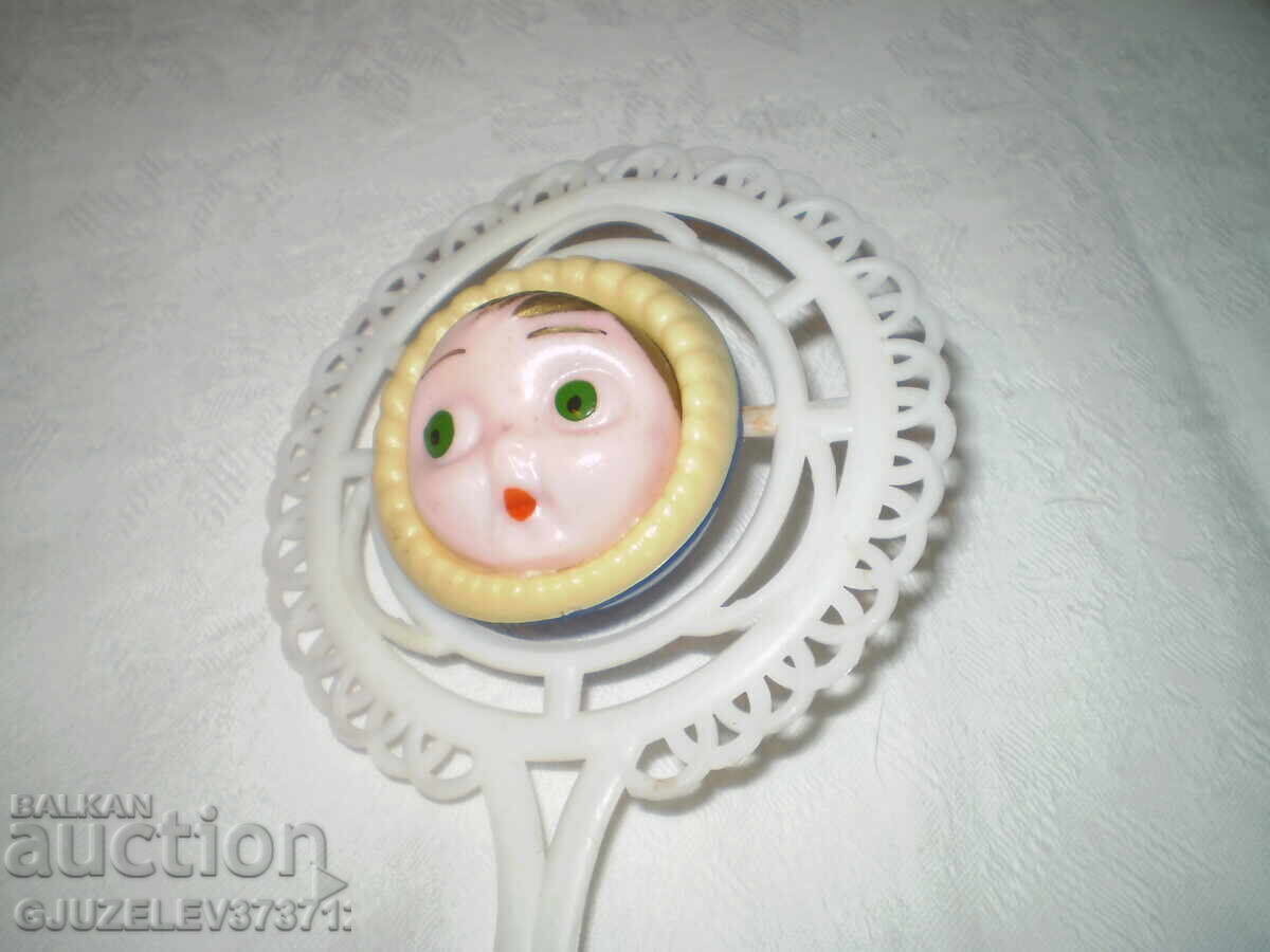 Delivery of Retro old baby toy Bakelite rattle