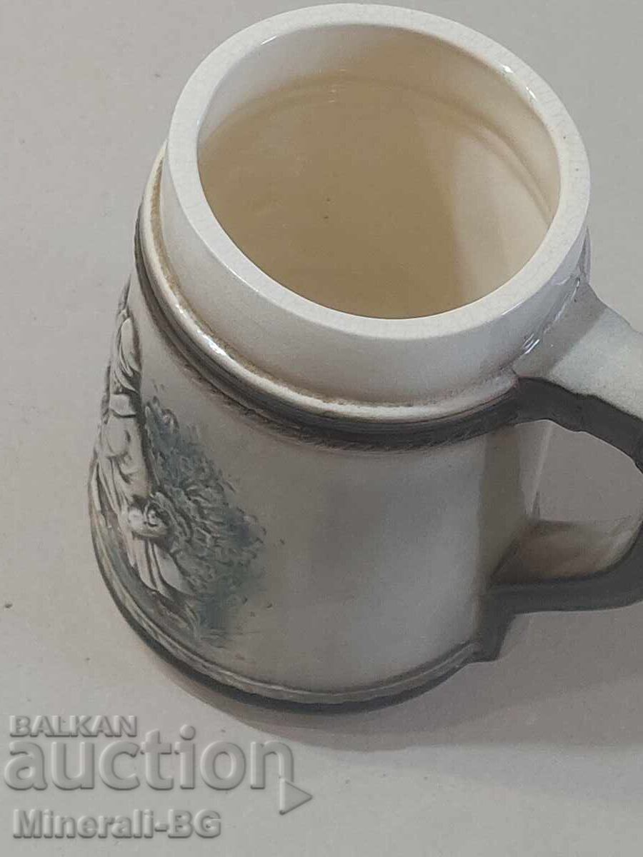 Auction  Old ornamented mug