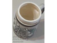 Old ornamented mug