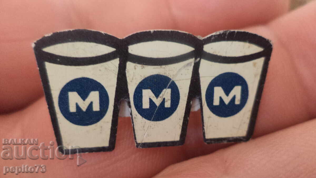 Insigna publicitară, MMM, marcă de produse lactate