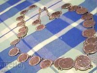 Όμορφο κολιέ από νομίσματα για φορεσιά