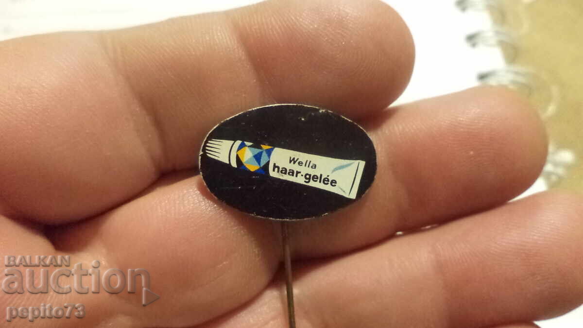 Insigna publicitară Wella, marcă de gel de păr