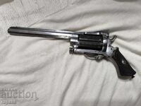 Small revolver, pepper spray. Pistol, saloon pistol, handgun