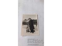 Photo Sofia A man and a little boy on the sidewalk