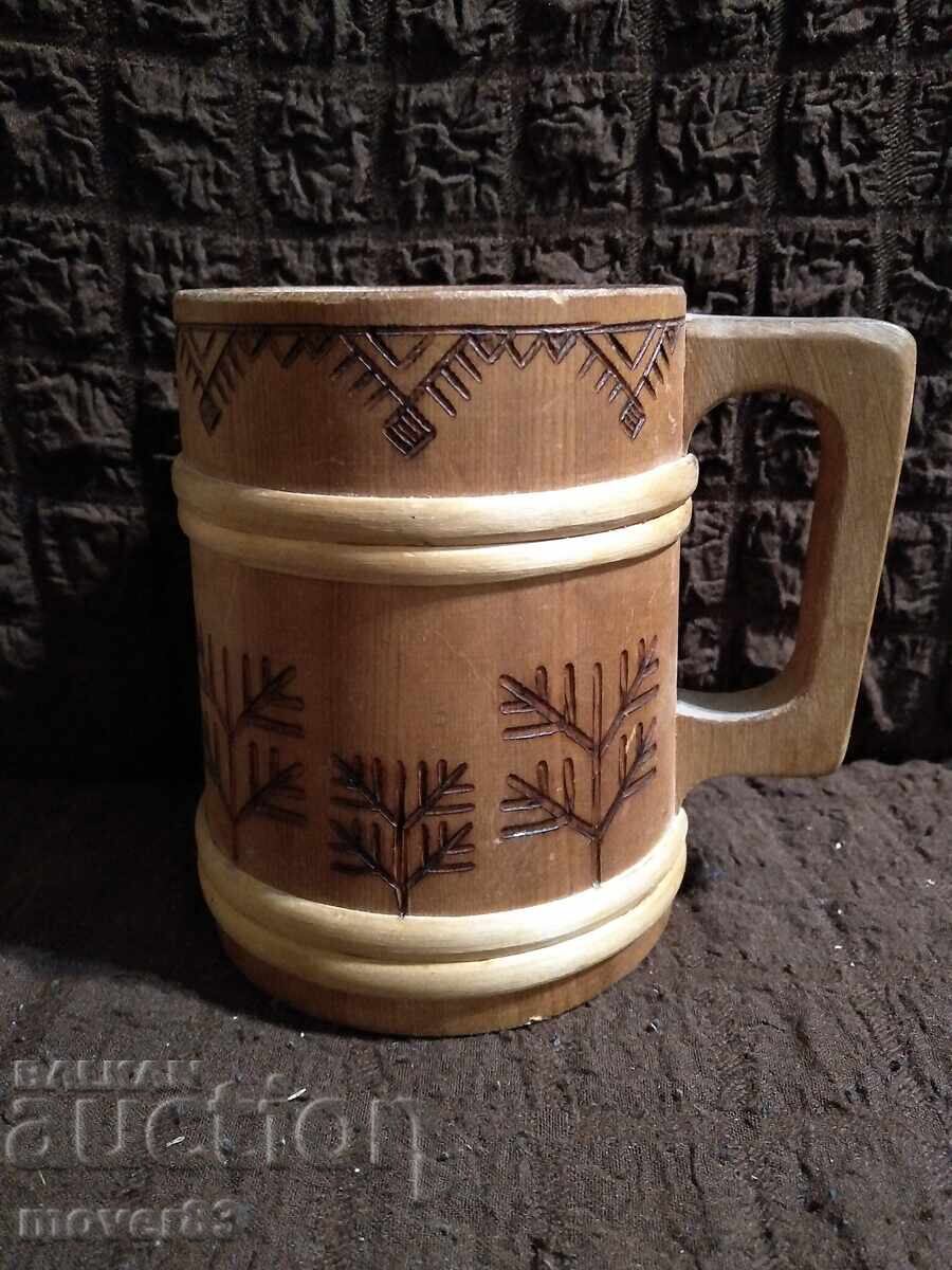 A wooden mug. A wooden mug.