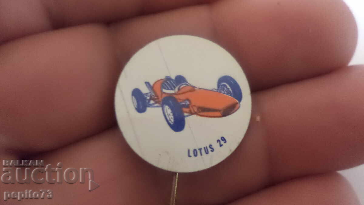 Insigna publicitară, Lotus 29, marcă auto