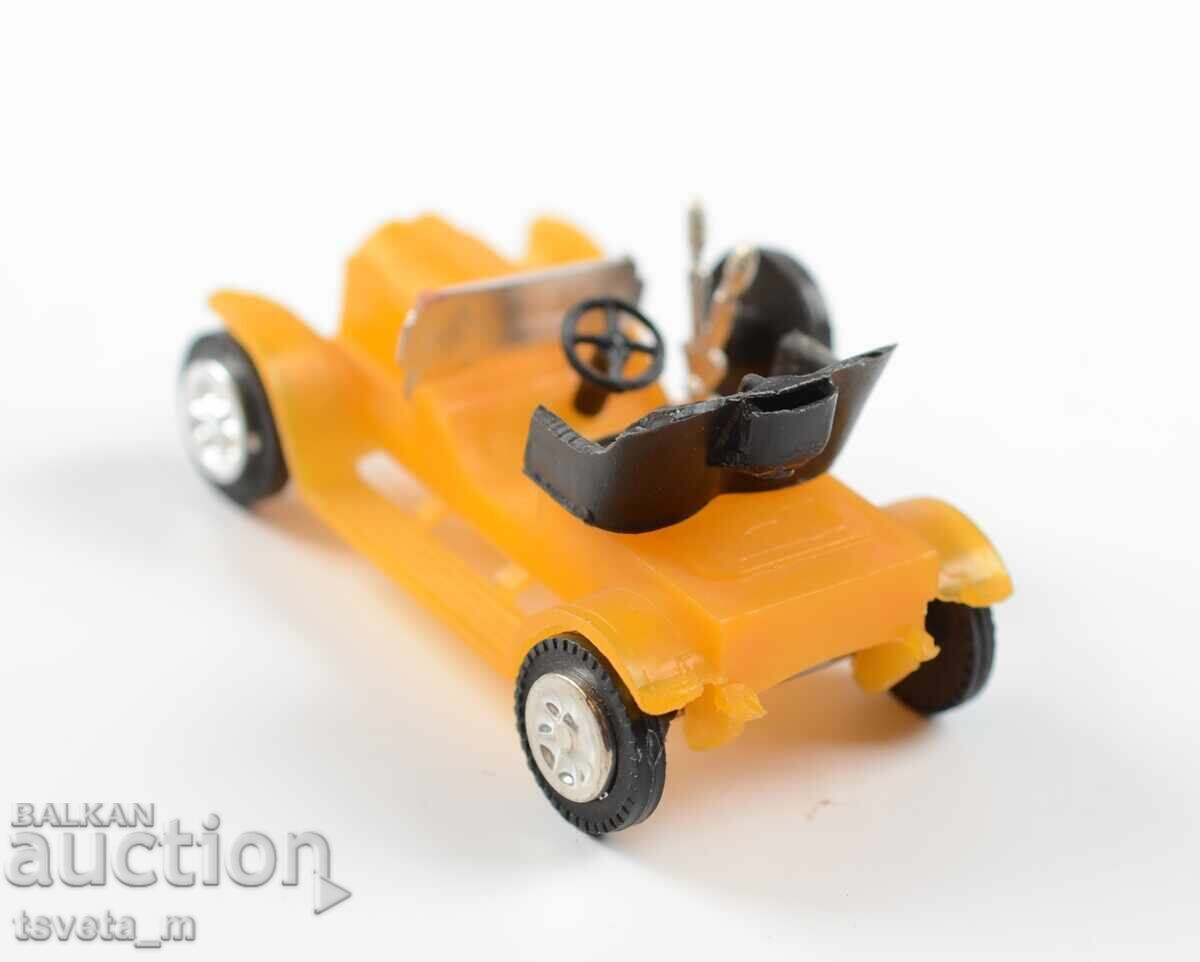 Auction  Plastic toy car model of an antique car