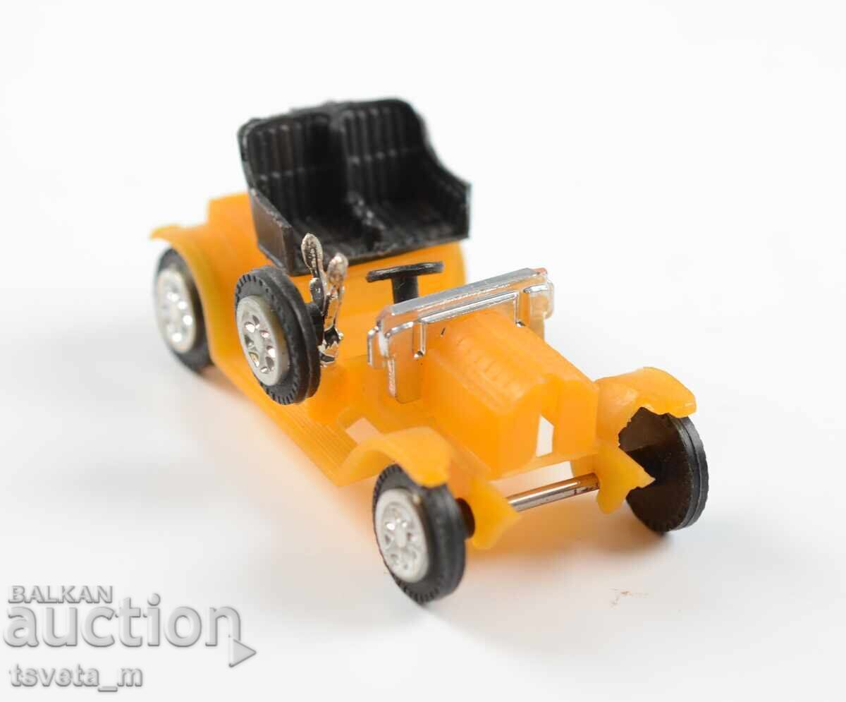 Delivery of Plastic toy car model of an antique car