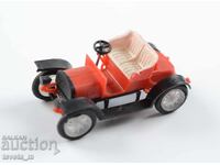 Plastic toy car model of an antique car