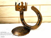 Beautiful candlestick holder from England with a horseshoe made of wrought iron