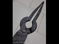 Old blacksmith's tongs, shingles, wrought iron