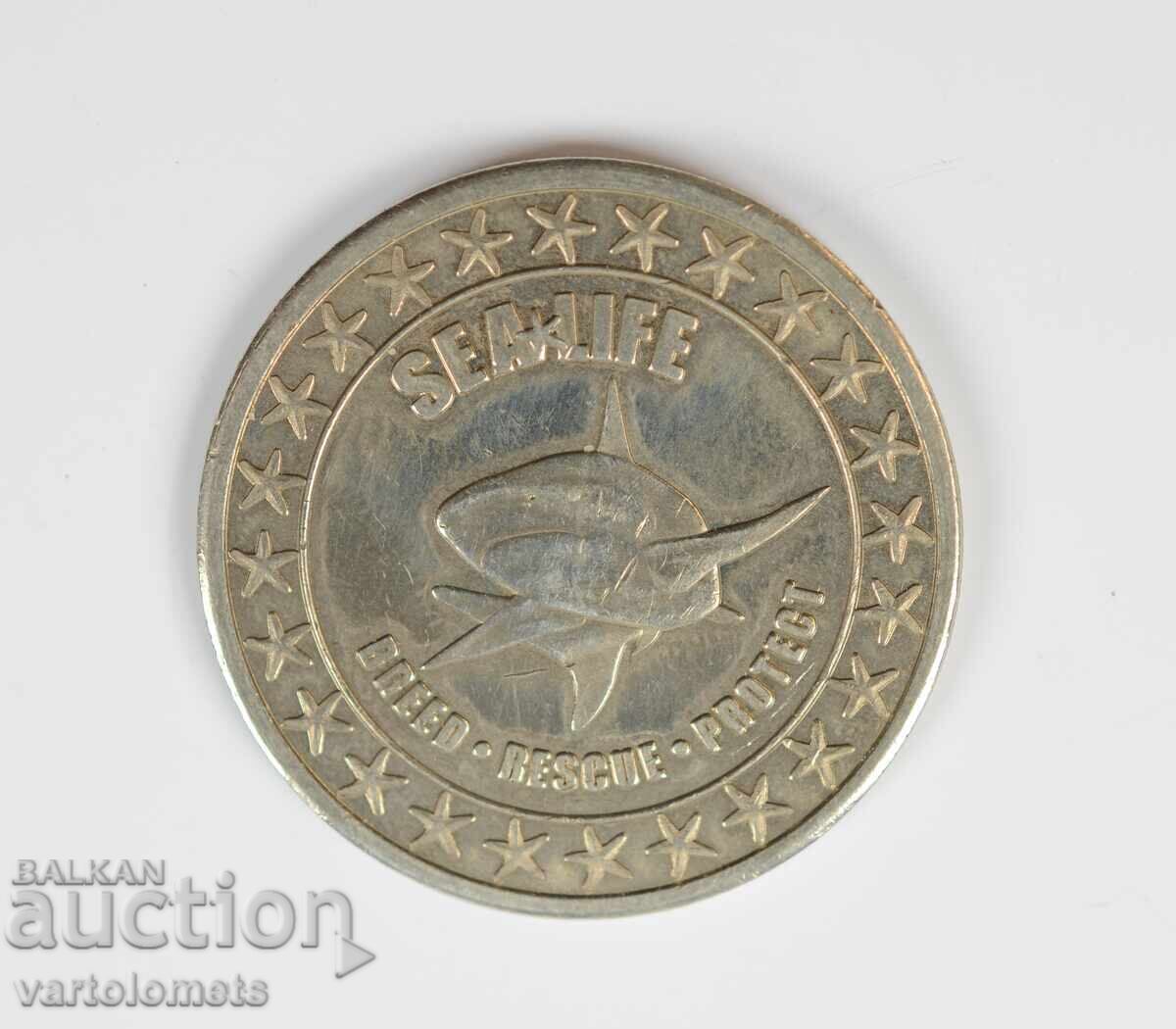 Medalie comemorativă / jeton de la lanțul de acvarii Sea Life