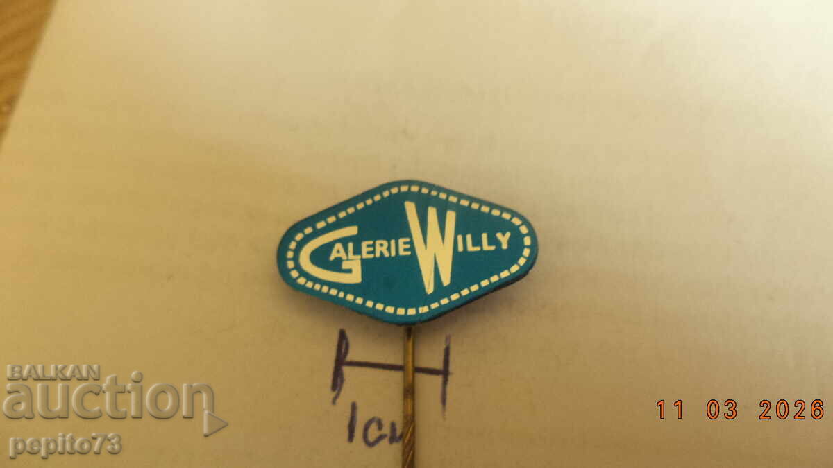 Insignă promoțională, Galerie Willy, centru comercial