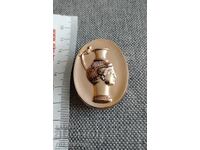 Old metal applique rhyton sign badge for mounting