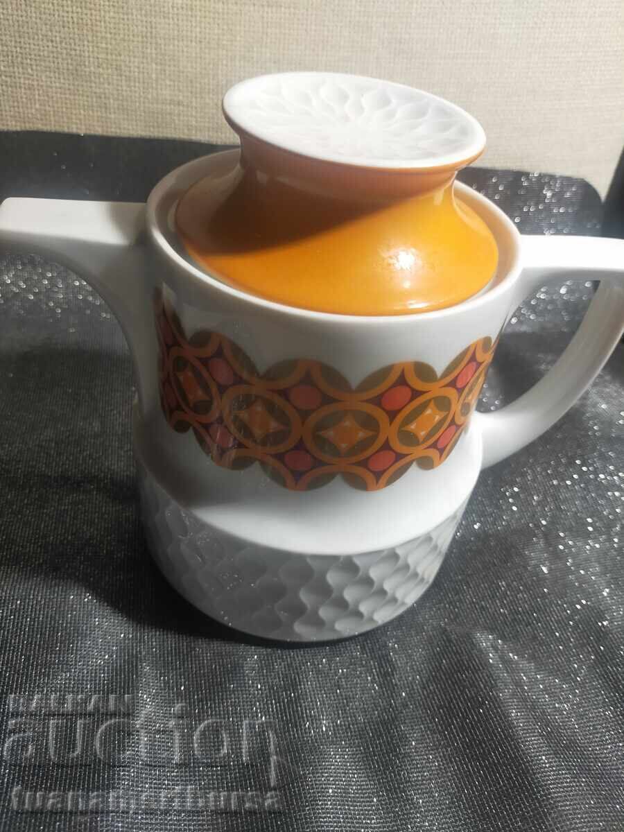 керамична кана с оранжеви и бели шарки