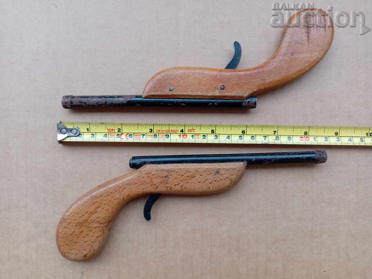 Delivery of Antique toys duel pistols metal and wood
