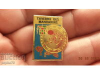 Taverne des Mandarins badge, French restaurant