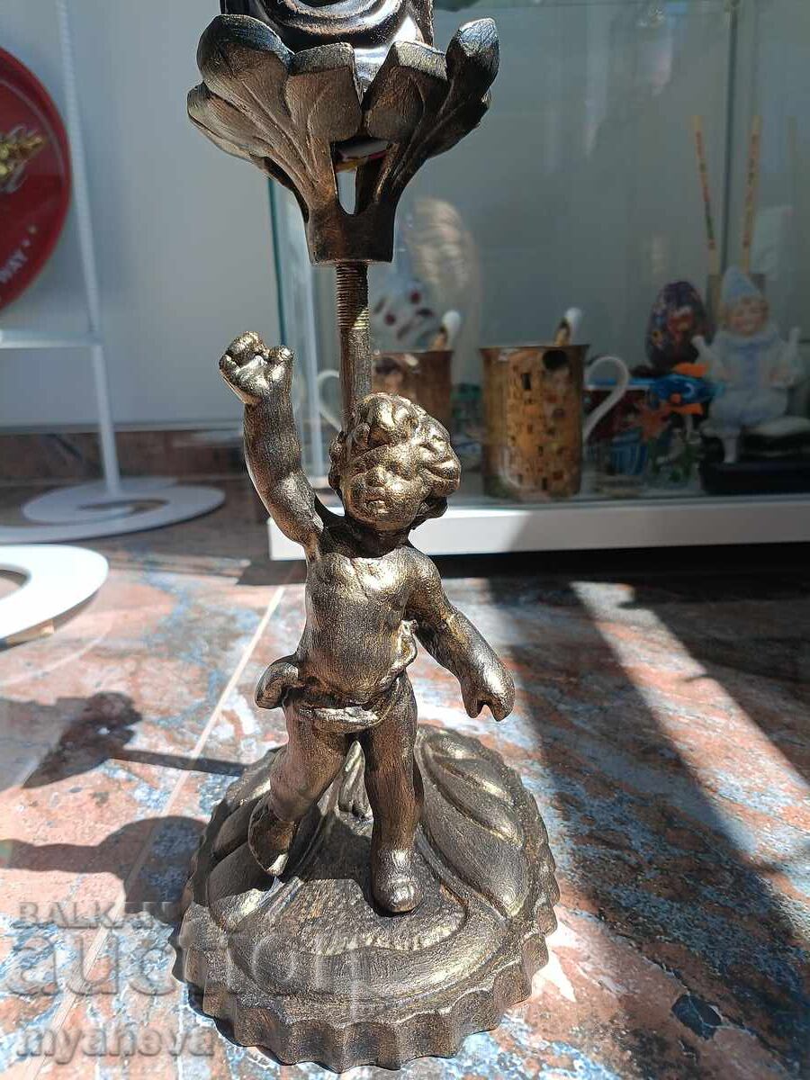 Auction  Baroque, metal candlestick with angel and candle
