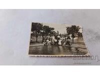 Photo Sofia Men and women by pool