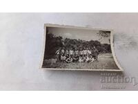 Photo Soldiers bare-chested in a meadow