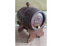 Carved wooden barrel on a stand for connoisseurs
