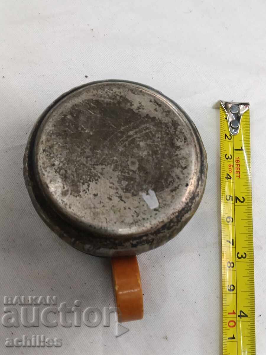 Auction Silver-plated mug with a Catalin handle Auction Silver-plated mug with a Catalin handle