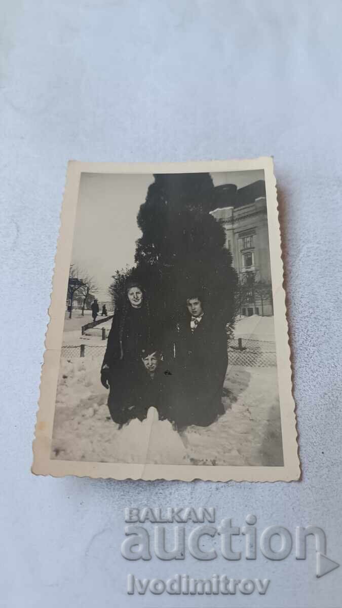 Photograph Sofia Young man and young woman in front of the University in winter Photograph Sofia Young man and young woman in front of the University in winter