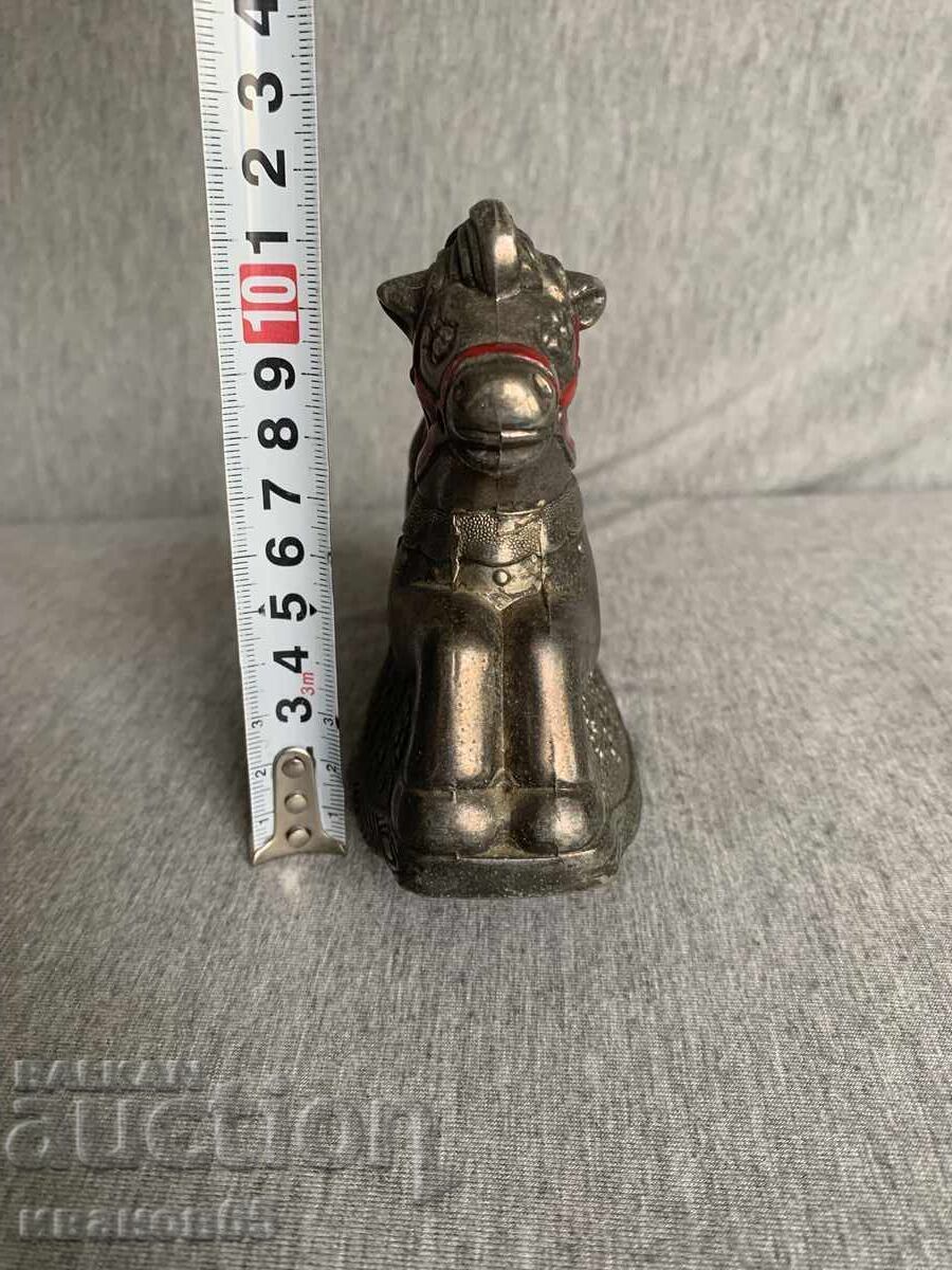 Delivery of Coin bank in the shape of a rocking horse