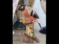 Exquisite porcelain figurine of a bullfinch